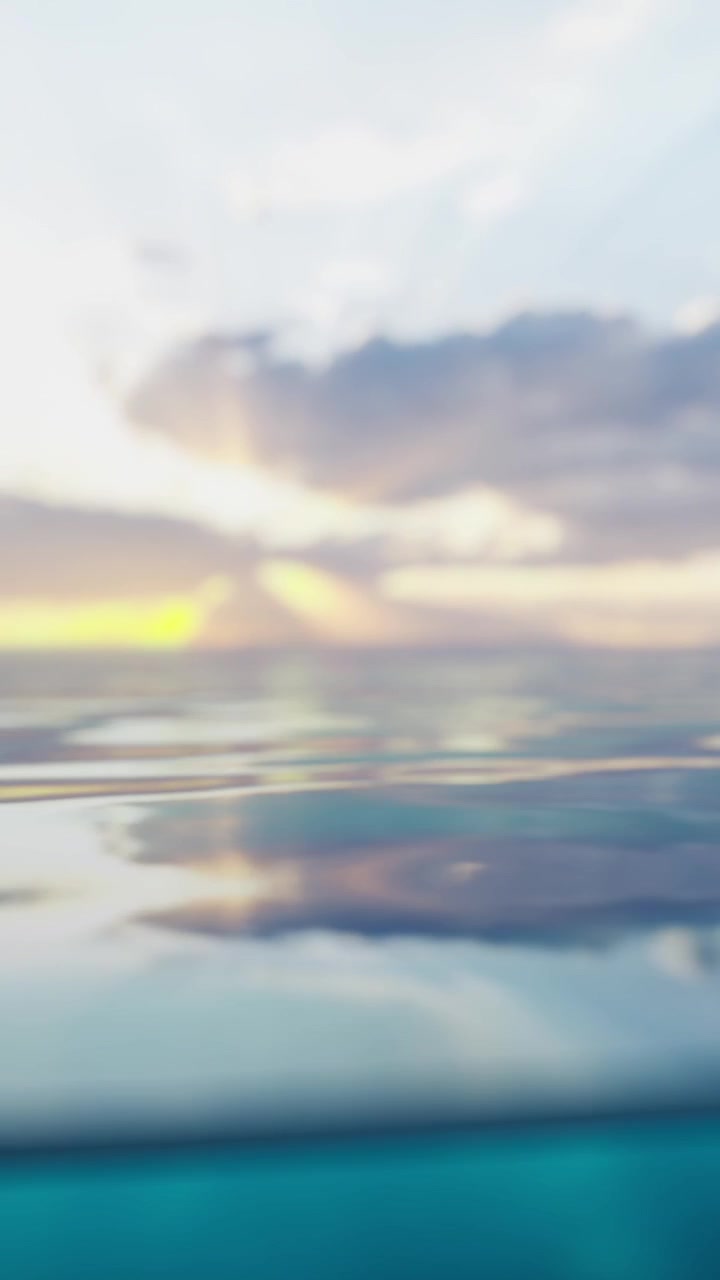 Bright sky and calm water during sunset near the ocean horizon