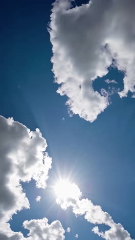 beautiful blue sky with clouds and sun