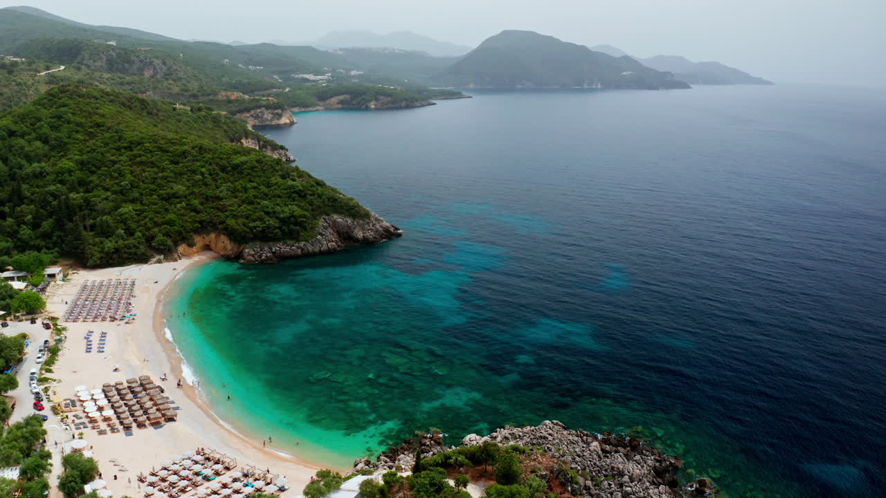 Aerial drone shot of Greek Landscape with Turquoise Sea or Ocean Bay and Empty Sand Beach