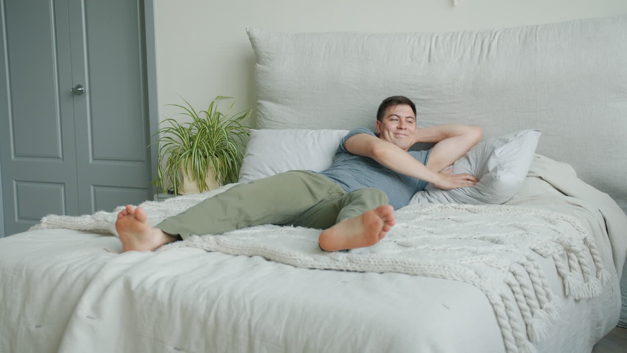 Man relaxing in bed