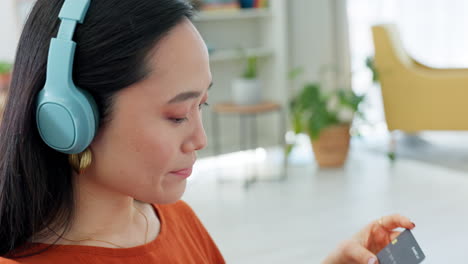 Credit-card,-laptop-and-woman-on-sofa-for-online