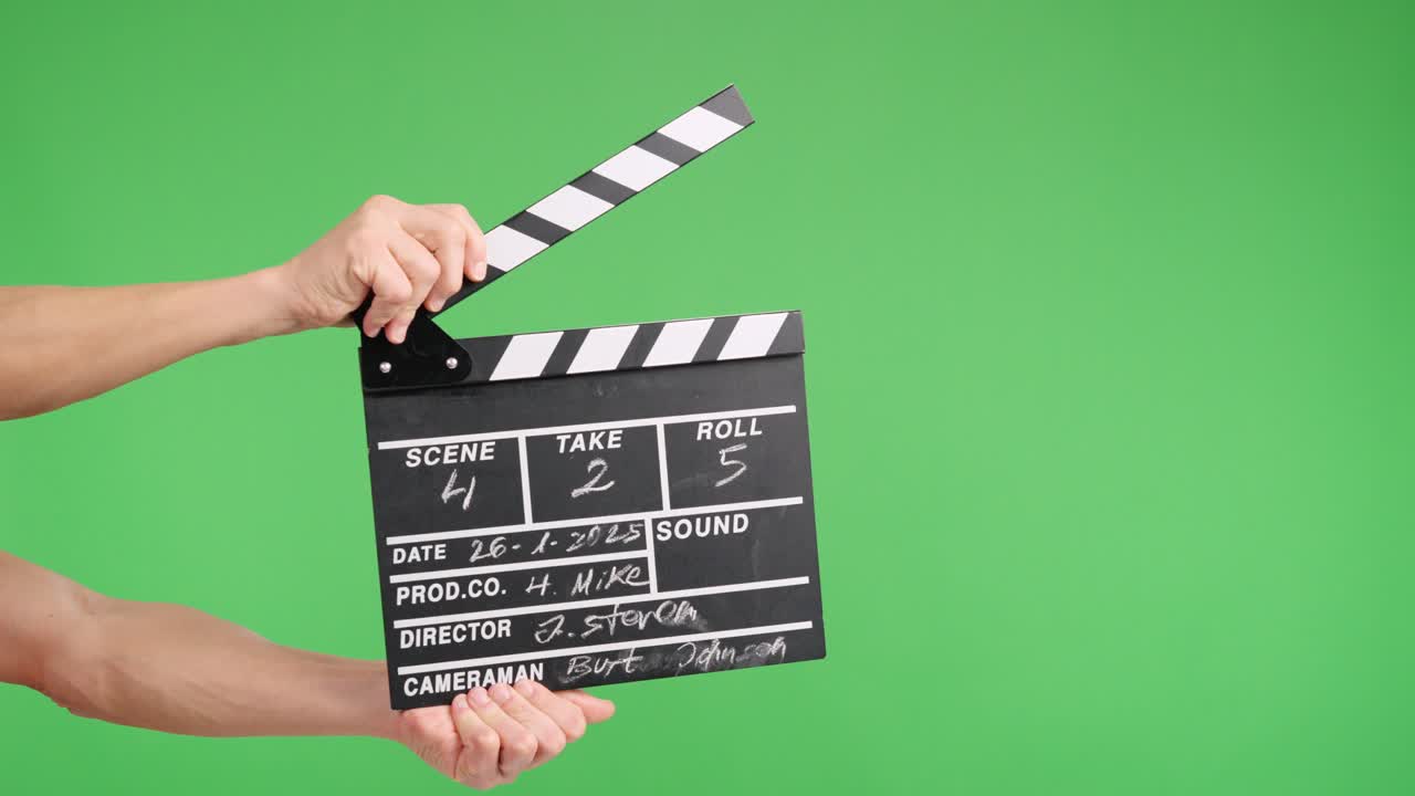 Film slate clapping on green screen for video production