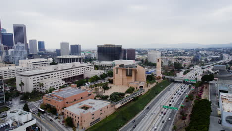 los angeles ca usa, aerial view, cathedral of our lady of the angels and us-101 highway traffic, drone shot