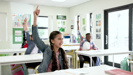 in school, multiracial students raising hands eagerly in classroom, engaging in lesson