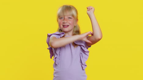 fit sporty child girl kid showing biceps and looking healthy feeling power strength success win