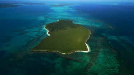 brush island is part of the archipelago of the isle of pines, new caledonia - aerial orbit