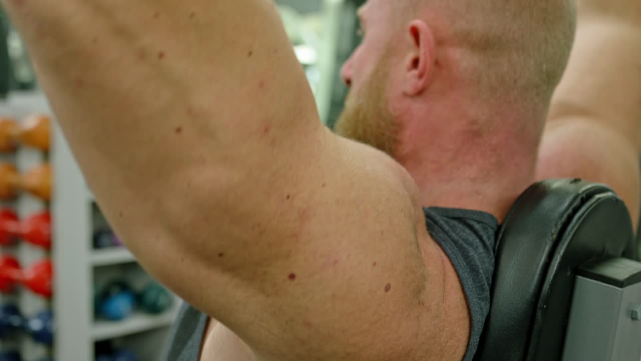 Powerful Man Exercising In Gym