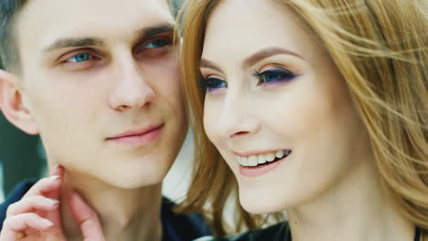 portrait of a young couple 20-25 years look into the distance smiling very happy