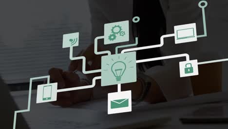 animation of network of digital icons over mid section of a woman working on her plan at office