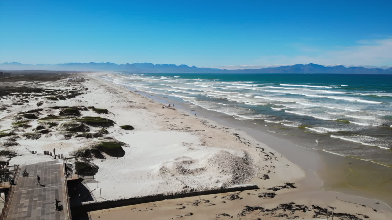 Aerial view of a beautiful beach with mountains in the distance