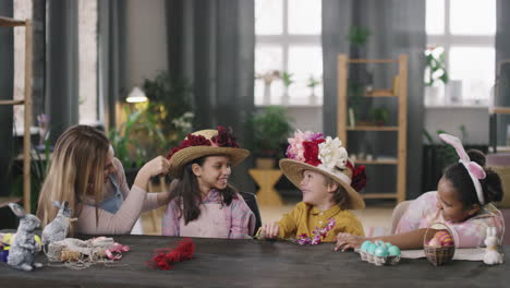 Happy Woman and Children in Easter Workshop