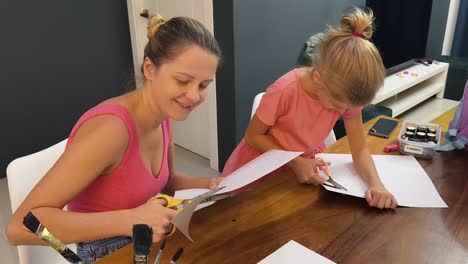 mother and daughter doing a craft activity