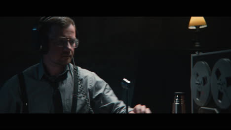 an intelligence officer listens to the wiretap recordings