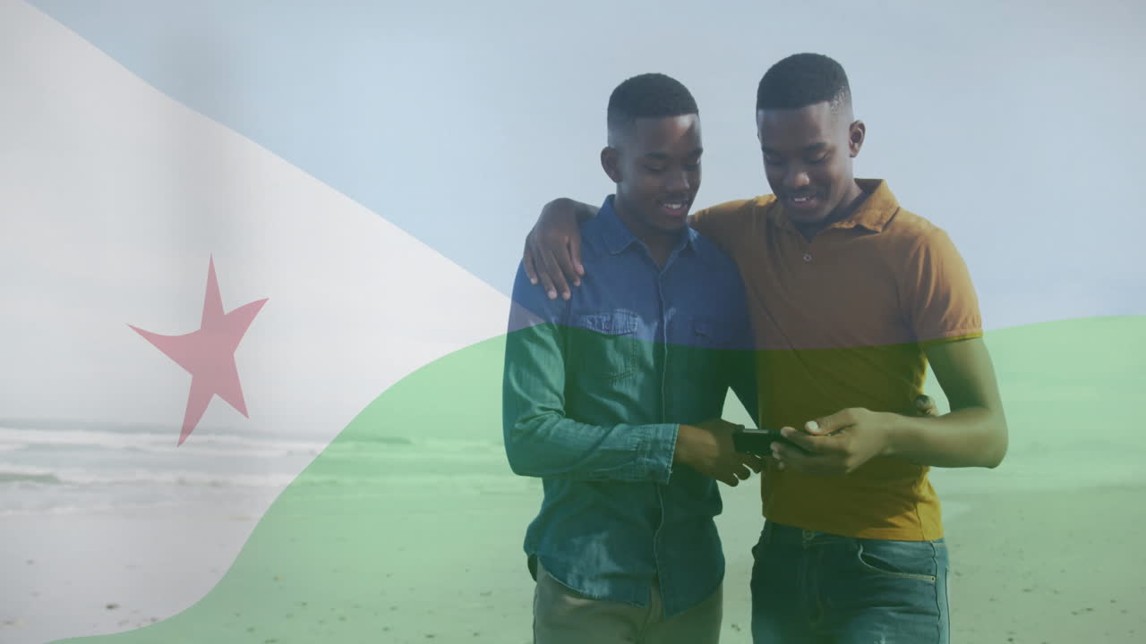 Walking on beach, two people with Djibouti flag animation overlay visible