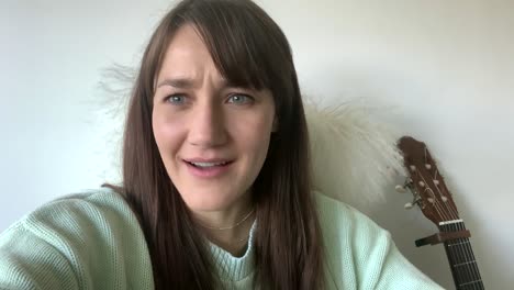 Woman-Saying-Cheers-To-The-Camera-During-Video-Call