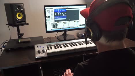 musician enjoying his music at computer