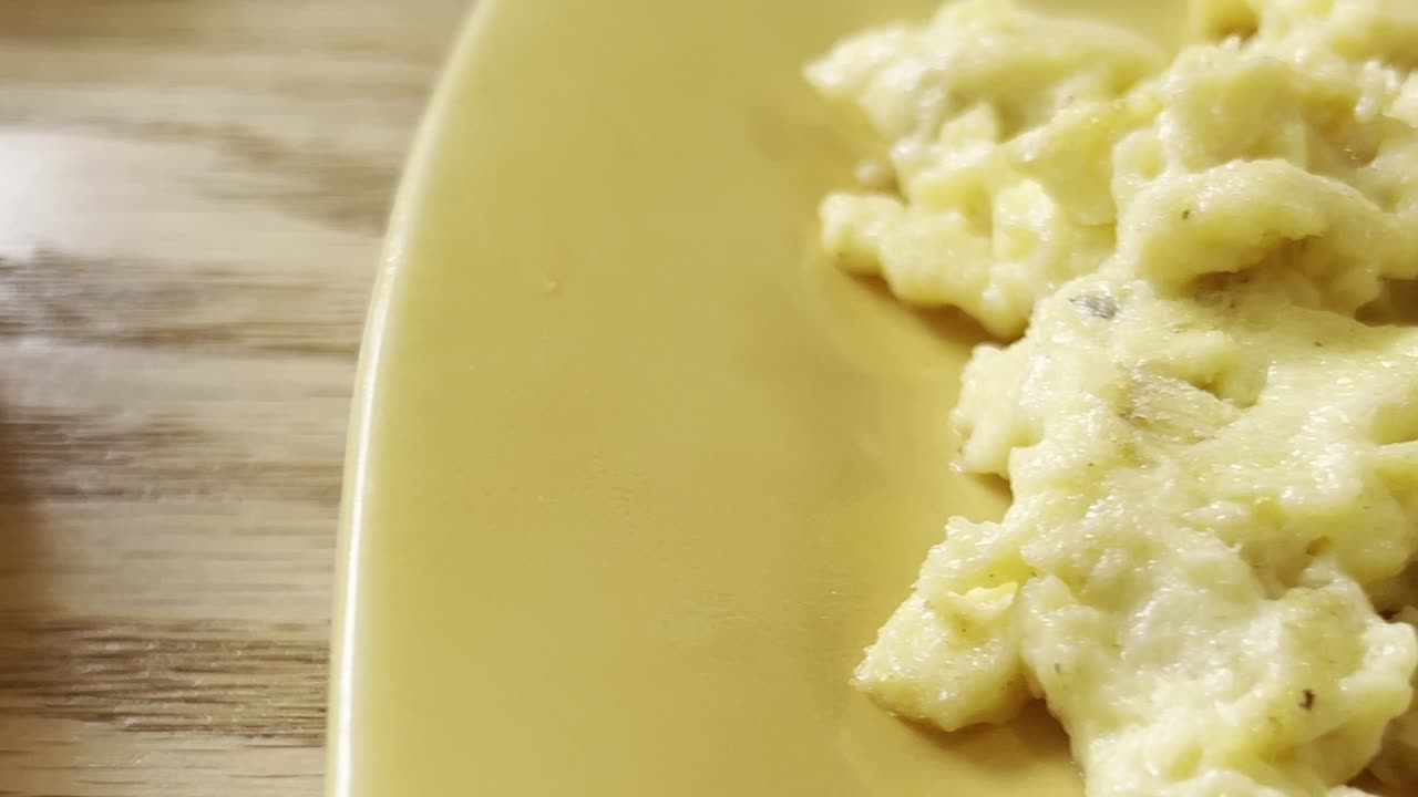 close-up of two plates full of fluffy and super appetizing pancakes ready to eat