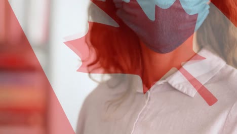 bandera canadiense ondeando contra una mujer que lleva una máscara facial