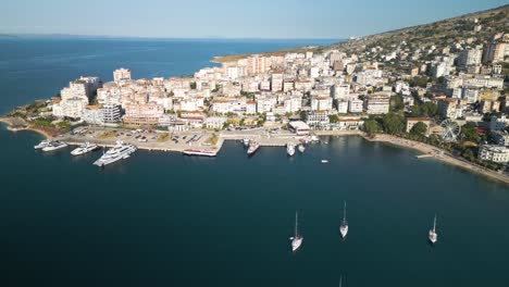 forward drone shot over saranda bay, albanian riviera