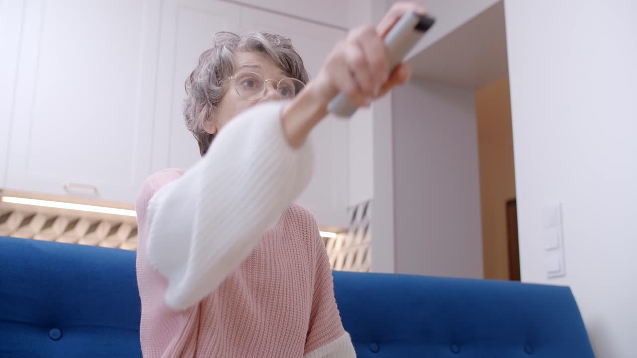 Senior Woman Using Remote