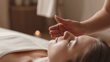 Woman Receiving a Calming Touch Therapy Session