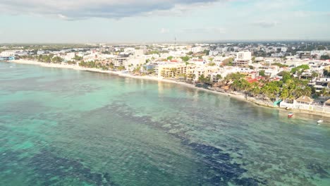 coastal aerial view of playa del carmen, mexico with calm sea and sunny weather