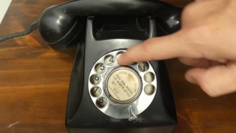 4k clip of an classic black vintage gec rotary dial phone