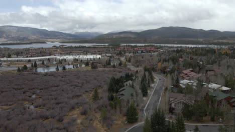 Aerial-dolly-view-over-neighborhoods-and-parks-with-Lake-Dillon-in-the-distance