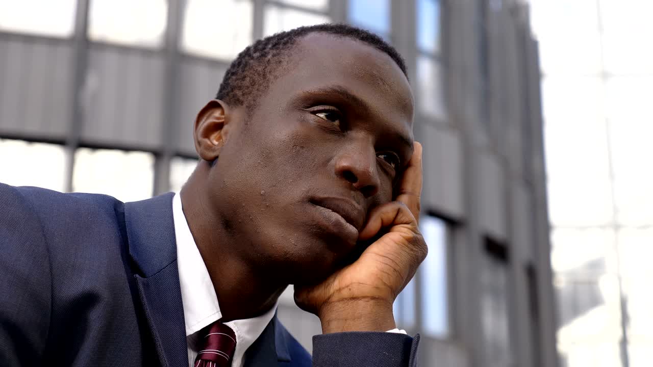 worried and stressed Young black businessman- close up- outdoor