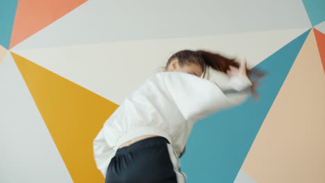 teenager dancing in a colorful studio