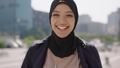 slow-motion-portrait-of-happy-mixed-race-muslim-business-woman-laughing-looking-at-camera-enjoying-sunny-urban-city-lifestyle