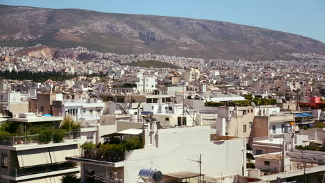 Wide-establishing-shot-panning-across-Athens-Greece-in-sunshine