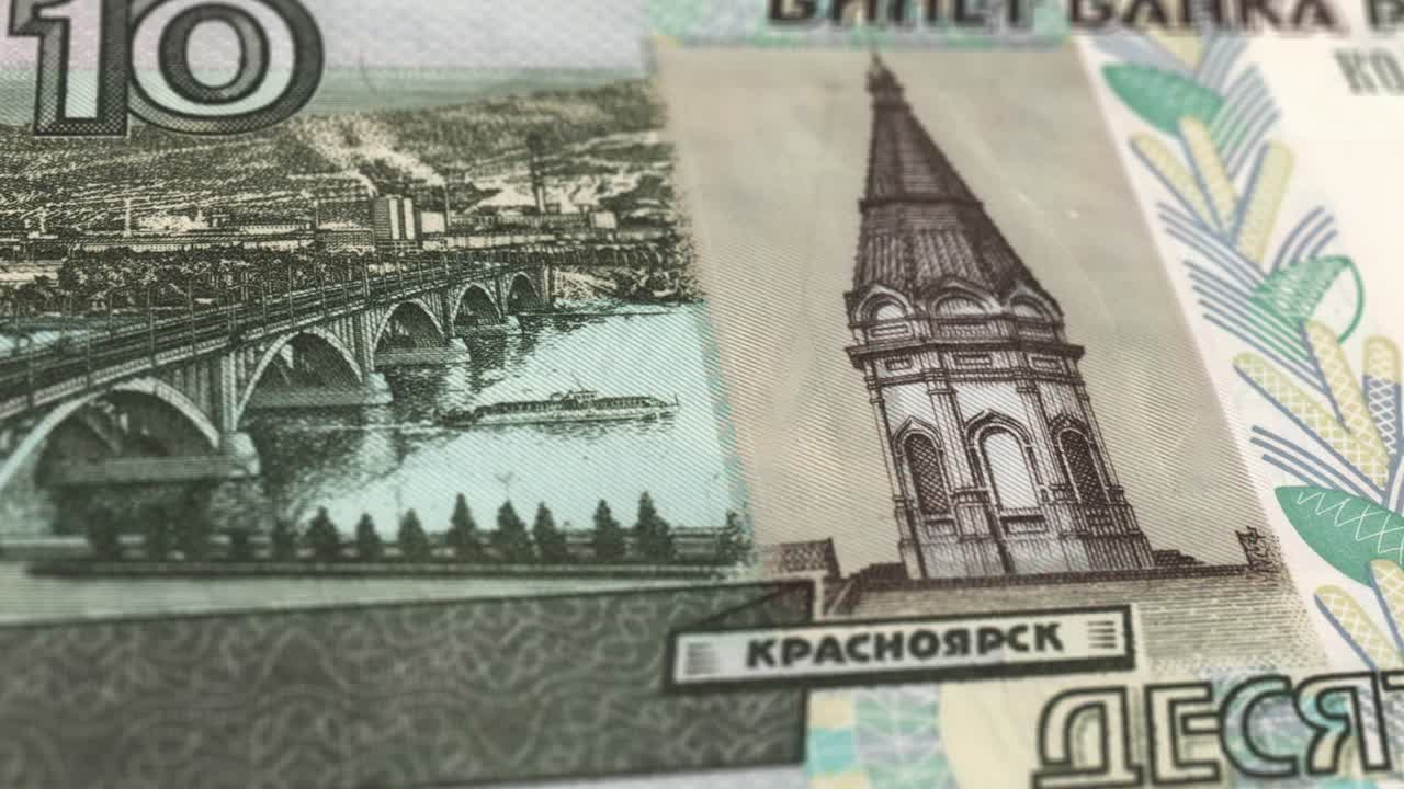 10 Russian Ruble - the National Currency of Russia - Extreme Detail of Russian Ruble Russian Currency - 10 ₽ Russian Ruble - Printing Money - 4K - Russian Federation Currency stock video - Obverse of 10 russian rubles