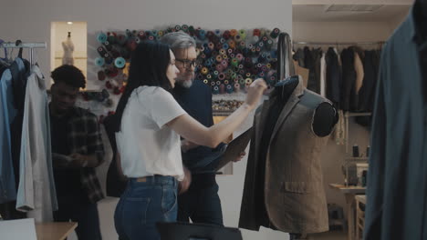 fashion design team working on a jacket