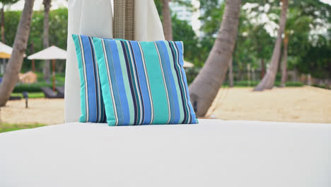 comfortable pillow on pavilion near beach - travel and vacation concept