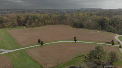 cloudy day over field drone shot - brandywine manor house, pa