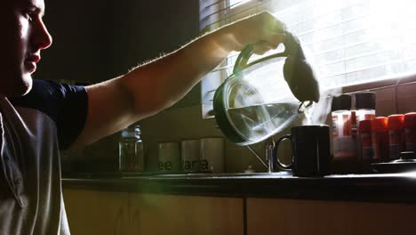 Disabled-man-preparing-coffee-in-kitchen-4k