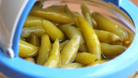 pickled green chili peppers in a jar