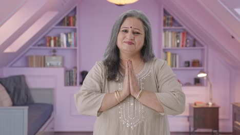 Happy-Indian-old-woman-greeting-and-doing-Namaste