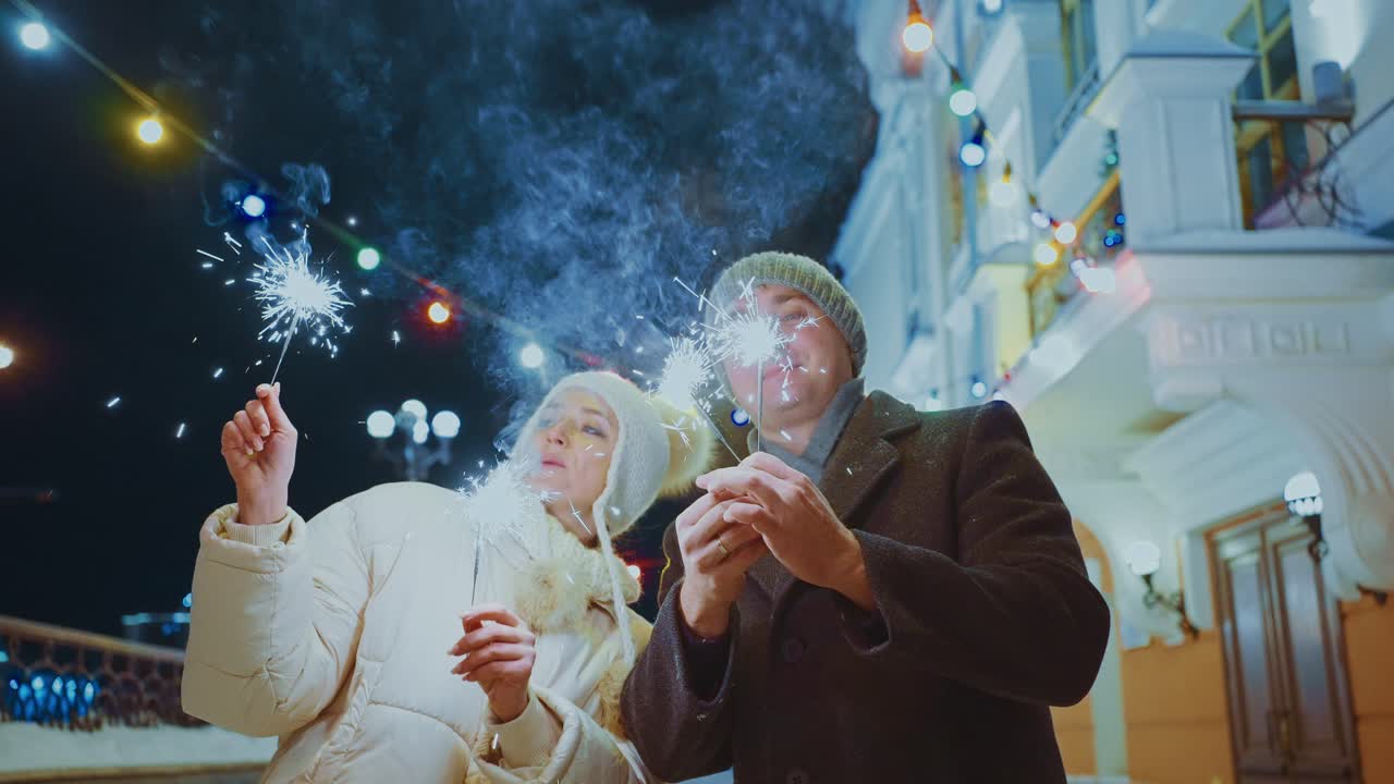 Couple Celebrating New Year's Eve with Sparkler