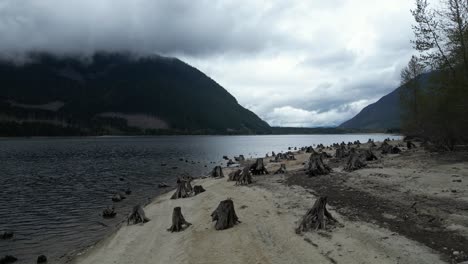 Scenic-Lake-surrounded-by-Mountains-on-a-Cloudy-Day