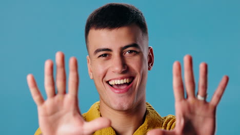 smiling man with outstretched hands