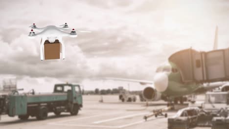 drone carrying a box in an airport