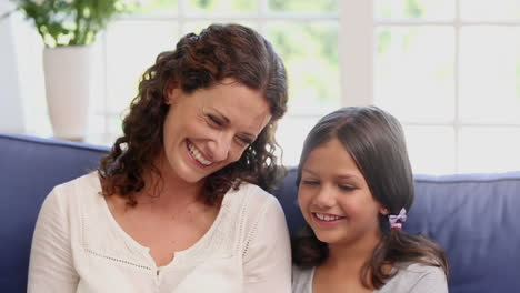 Mother-and-daughter-using-laptop