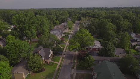 Fast-descent-from-over-houses-in-nice-suburban-neighborhood-down-to-houses-below