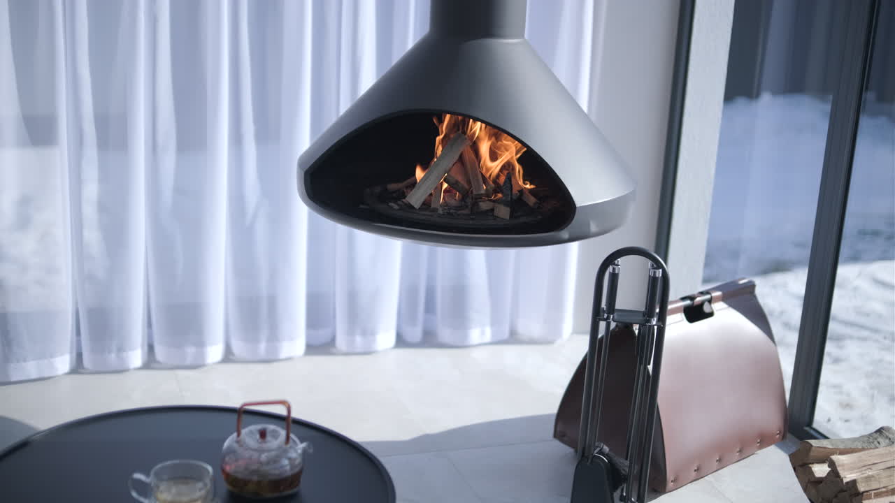 Modern Hanging Fireplace with Burning Logs in a Cozy Winter Interior