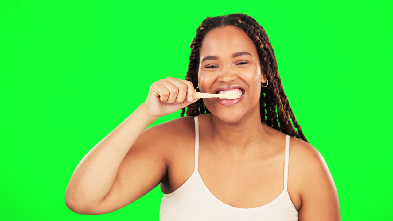Green screen, face and happy woman brushing teeth