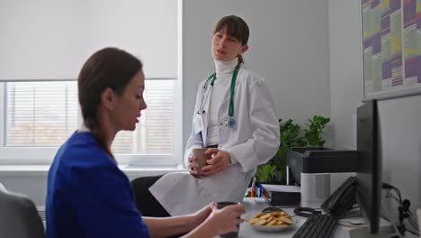 doctor and nurse discussing in the medical office