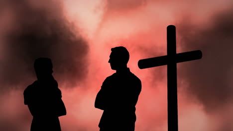 animation of silhouette of couple over clouds and cross