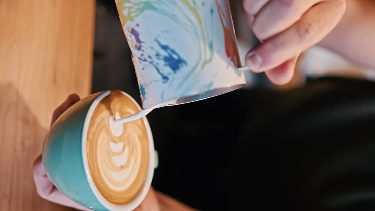 Barista making coffee in a coffee house in Brasov, Romania